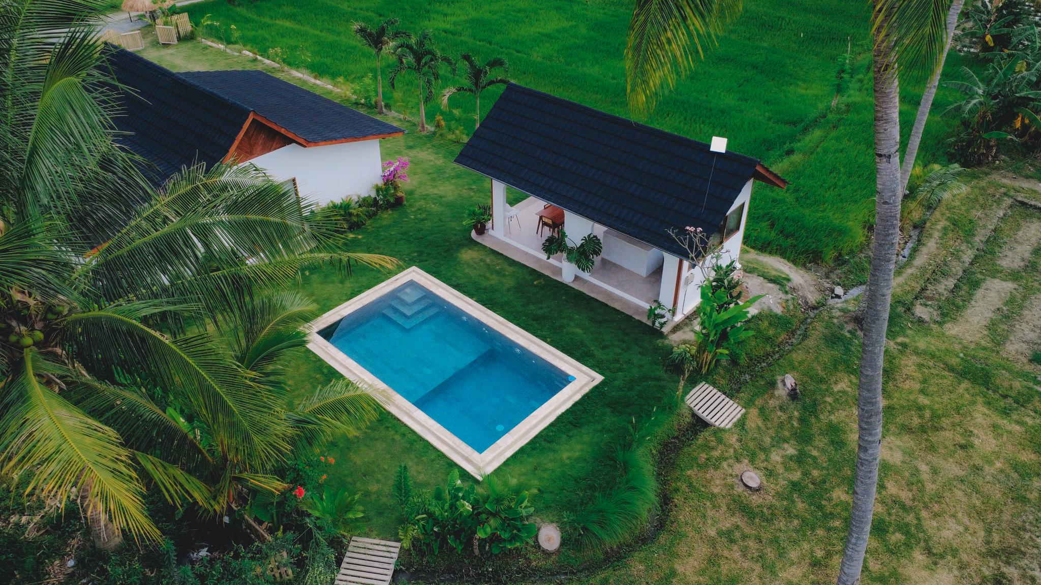 Villa Palu pool deck at golden hour